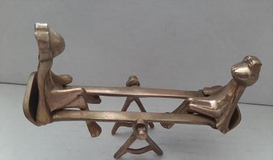 brass vintage frogs on swing