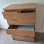 Two sets of wooden drawers. Image 3