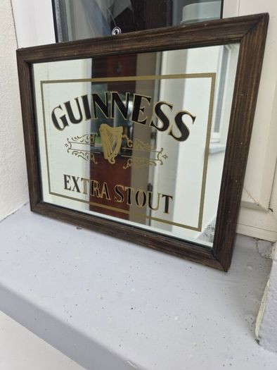 old small Guinness mirror