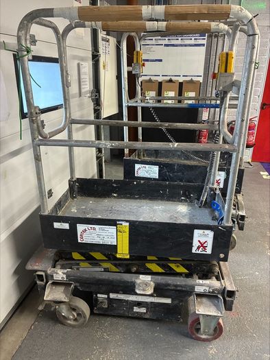 Push around scissor lift