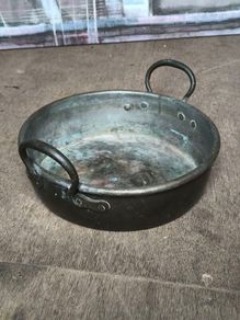 Antique riveted copper pot