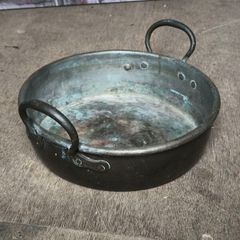 Antique riveted copper pot