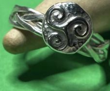 Handmade sterling silver Triskele woven ring. Size K
