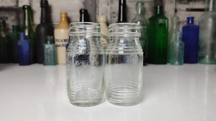 335 - Set of 2 Vintage Clear Glass Collectible Decorative Jars