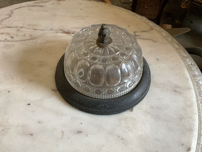 Old brass mounted glass ceiling light in a low profile