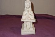 Praying girl statue