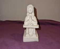 Praying girl statue