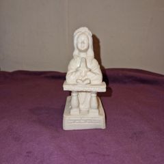 Praying girl statue