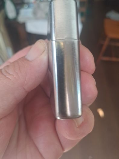 Champ Flip top petrol lighter.