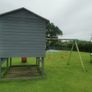Playhouse with slide and swings Image 3