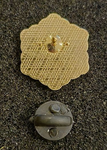 Snowflake,  pin back badge.