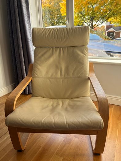 Cream leather armchair and matching footstool