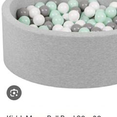 ball pit with balls, blankets, sleepsuits, playmats
