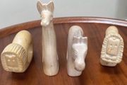 Four sandstone animal serviette holders or ornaments