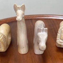 Four sandstone animal serviette holders or ornaments