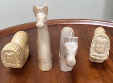Four sandstone animal serviette holders or ornaments