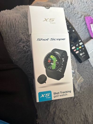 Golf watch with tags and spare tags