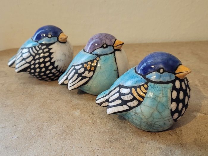 Mid-century trio of handpainted ceramic birds
