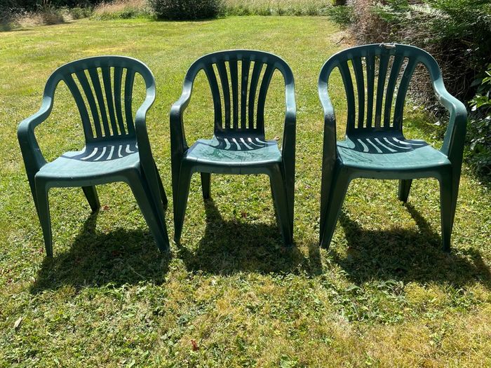 Green plastic garden chairs