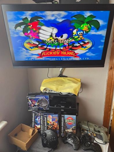 Sega Saturn w/ 3D Control Pad, Arcade Racer, Lightgun and Games
