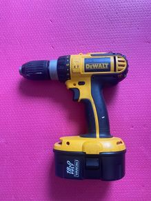DeWalt 18 V combi drill including two batteries, charger and case. The batteries are not DeWalt but our NEW (less than a year-old).