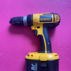 DeWalt 18 V combi drill including two batteries, charger and case. The batteries are not DeWalt but our NEW (less than a year-old).