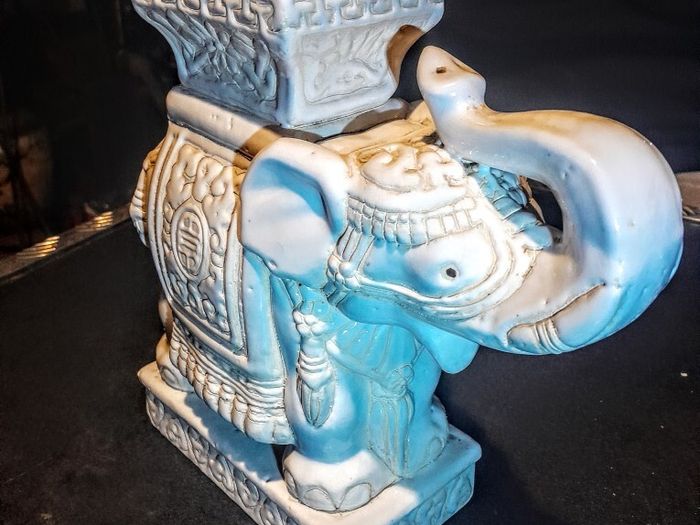 White ceramic elephant stand