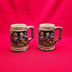 Two German-style ceramic mugs with the words JERSEY on them
