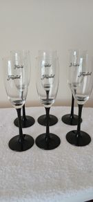 6 Champagne glasses. Freixenet.  Black stemmed.