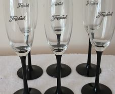 6 Champagne glasses. Freixenet.  Black stemmed.