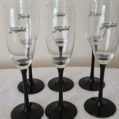 6 Champagne glasses. Freixenet.  Black stemmed.