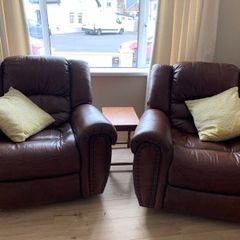 Two lovely brown leather reclining chairs for sale