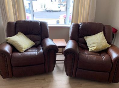 Two lovely brown leather reclining chairs for sale