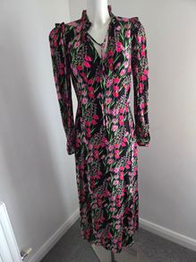 New. Warehouse Size 8 Black Floral print dress with frill trim.