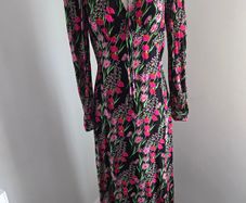 New. Warehouse Size 8 Black Floral print dress with frill trim.