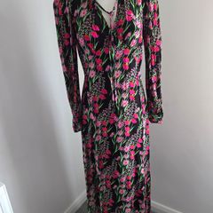 New. Warehouse Size 8 Black Floral print dress with frill trim.