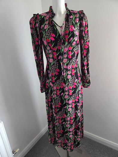 New. Warehouse Size 8 Black Floral print dress with frill trim.