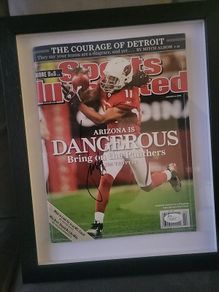 Framed Larry Fitzgerald autographed sports illustrated magazine with Cos