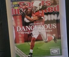 Framed Larry Fitzgerald autographed sports illustrated magazine with Cos