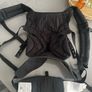 Black Ergobaby Omni 360 Baby Carrier featuring adjustable waist snaps on the front Image 2