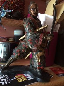 A fine bronze of a samurai signed  MIYAO