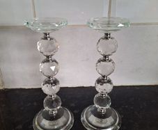 A pair of crystal glass pillar candleholders