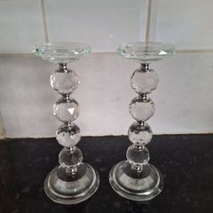 A pair of crystal glass pillar candleholders