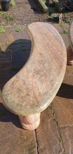 Sandstone garden table and two benches.
