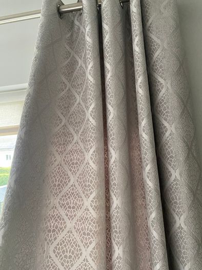 Grey patterned eyelet curtains