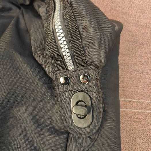 Large black expandable travel bag with shoulder strap