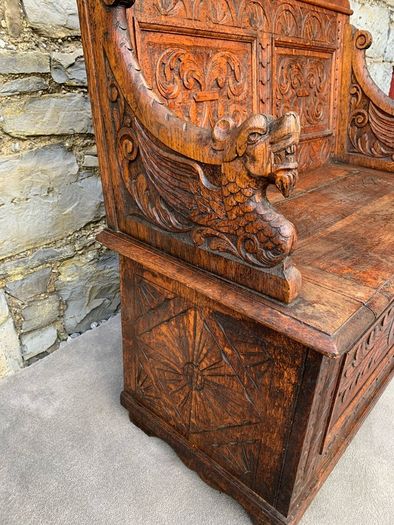 Late Victorian Gothic Revival Carved Oak Hall Settle.