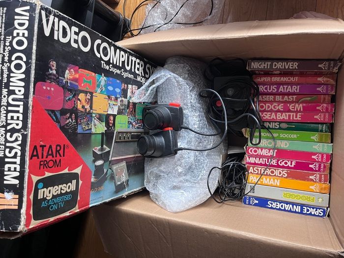 Atari 2600 Space Invaders Woody Atari 2600 with 15 individual games and 14 game Indy 500 driving