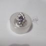 a silver dress ring with 10 white stones and purple stone Image 3
