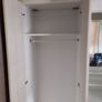 Double bedroom wardrobe with drawers and mirror in-between wardrobes and plenty of storage above Image 5